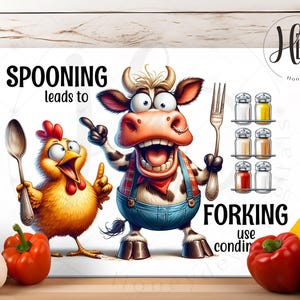May include: A whimsical kitchen-themed print featuring a cartoon chicken holding a spoon and a cow holding a fork. The text reads "Spooning leads to forking". Salt and pepper shakers are also shown.