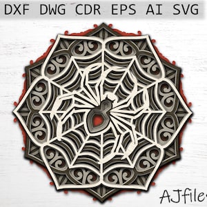 May include: A black and white spider web mandala with a spider in the center. The mandala is made of intricate patterns and is perfect for laser cutting.