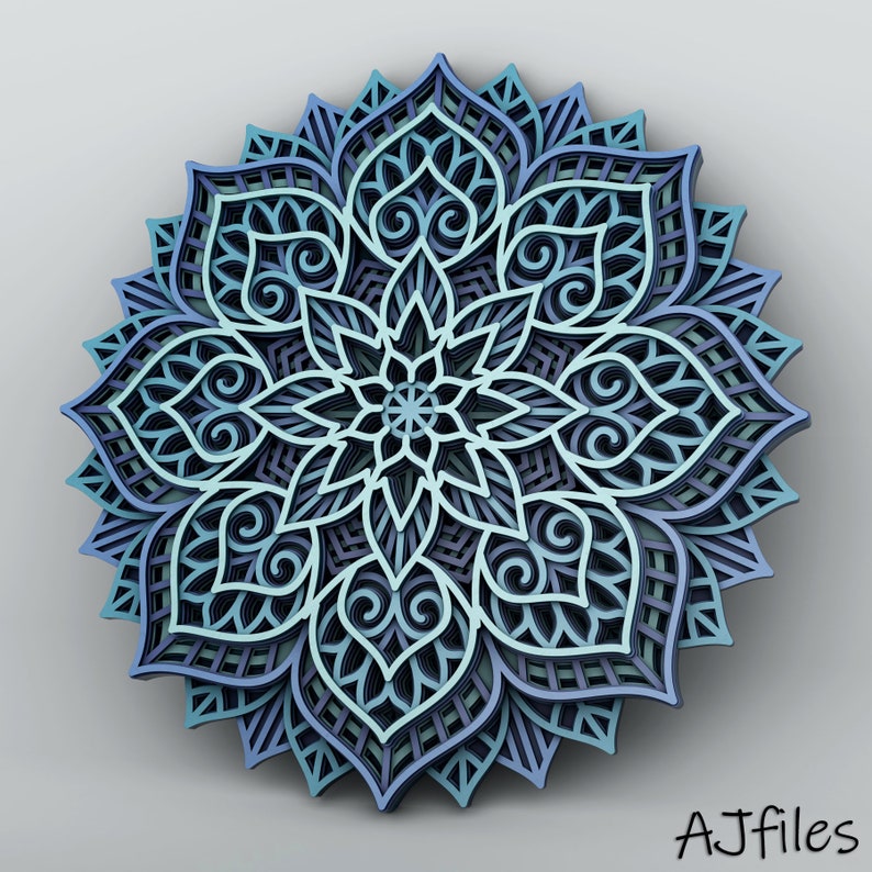 May include: A layered, three-dimensional mandala in shades of blue, teal, and purple. The intricate design features floral and geometric patterns, with a central star-like element. The artwork is set against a neutral gray background.