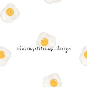 May include: A seamless pattern featuring multiple white fried eggs with yellow yolks on a white background. The text '@backmystitchup_design' is in the centre of the image.