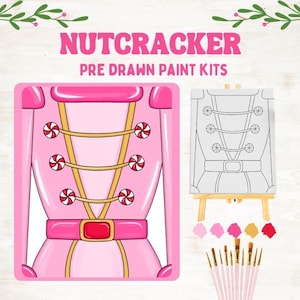 May include: Pink Nutcracker pre-drawn paint kit. The image shows a pink illustration of a Nutcracker jacket with candy accents, a canvas on a small easel, paint brushes, and paint colors. The text "NUTCRACKER PRE DRAWN PAINT KITS" is at the top.