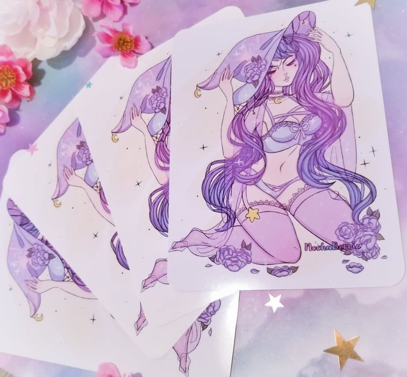 May include: A set of five purple and white illustrated stickers featuring a woman with long purple hair wearing a purple and blue witch hat and lingerie. The stickers have a white background with a light purple and blue galaxy pattern. The text "Magical Babie" is in the bottom right corner of the sticker.