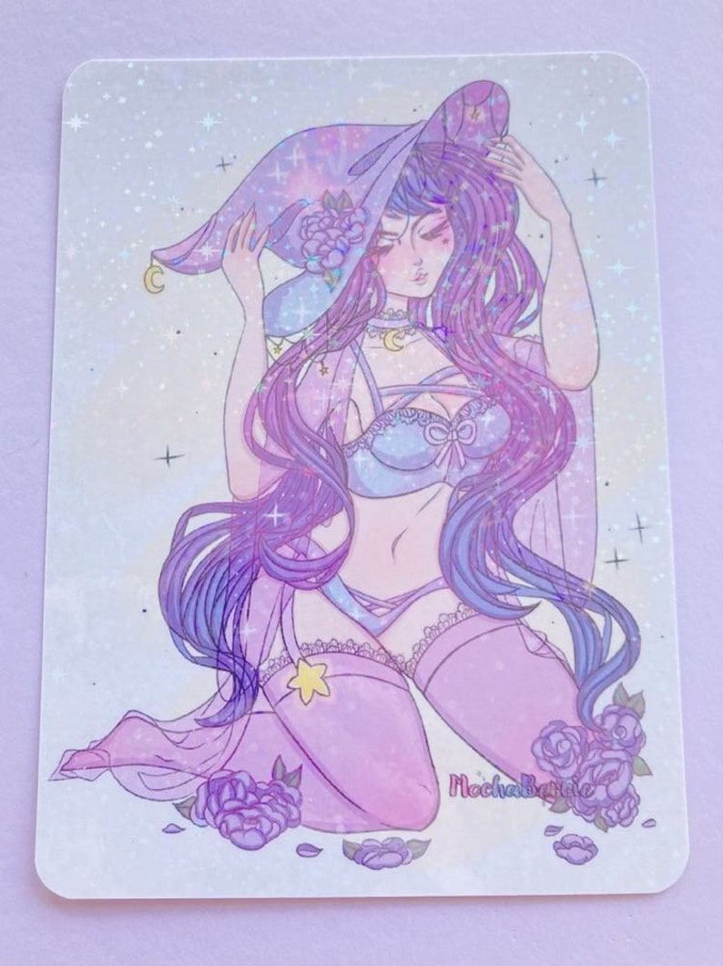 May include: A purple and blue illustration of a witch wearing a hat with stars and a crescent moon. She is wearing a blue and white bra and pink stockings. The background is a sparkly white with purple flowers.
