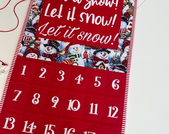 Countdown to Christmas Calendar with Colorful Snowmen, Red and White Stripe Binding, and "Let it Snow" Text