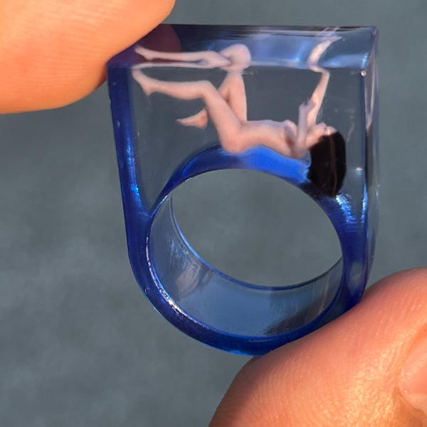 Suspended Dreamer Resin Ring - Blue Epoxy Encased Falling Lady - Artisan Narrative Ring Crystal Clear Epoxy Resin Woman Sculpture Art Ring