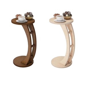 May include: Two side tables with curved legs and round tops. The table on the left is brown wood and the table on the right is natural wood.