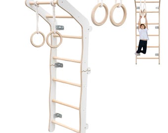 May include: White wooden climbing frame with a ladder and two hanging rings. The frame is mounted on a wall and has a curved top. A child is shown hanging from the rings.