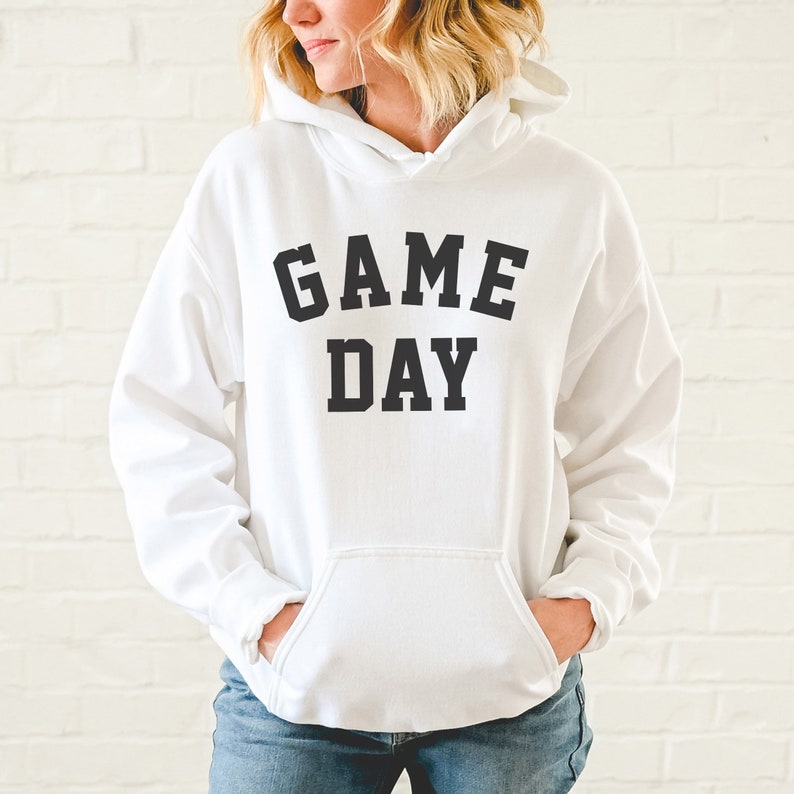 May include: White hooded sweatshirt with black text that reads "GAME DAY".