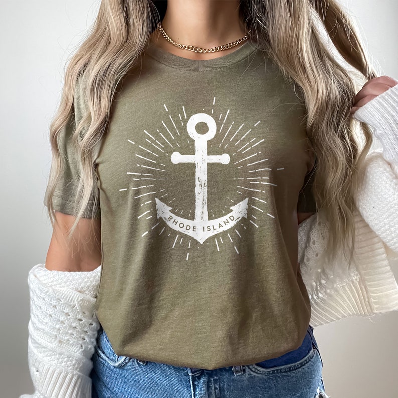 May include: A green t-shirt with a white anchor graphic and the text "Rhode Island".