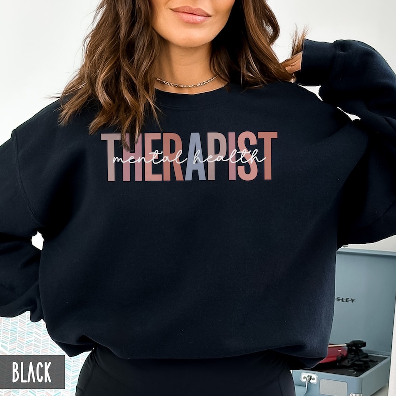 May include: Black sweatshirt with the text "THERAPIST mental health" in rainbow colors.