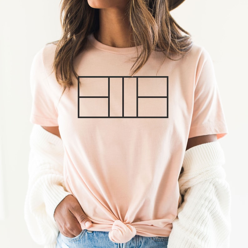 May include: A pink t-shirt with a black tennis court graphic design.