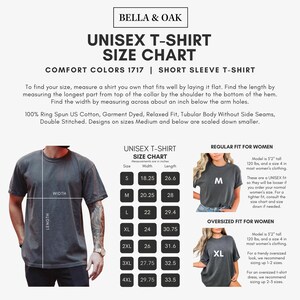 a man wearing a gray tshirt with measurements