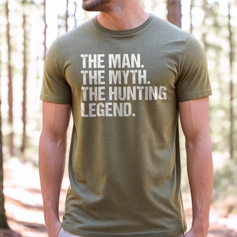 May include: A green t-shirt with white text that reads "The Man. The Myth. The Hunting Legend."