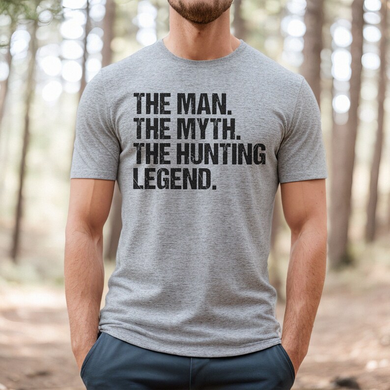 May include: A gray t-shirt with the text "THE MAN. THE MYTH. THE HUNTING LEGEND." printed on it.