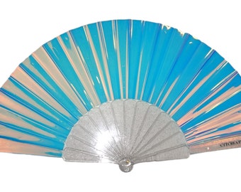 May include: A blue and iridescent folding fan with a silver glitter handle. The fan has a website address printed on the back: "CTICREATIONS.COM".