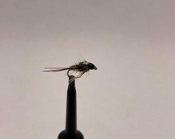 May include: A brown and black fly fishing lure with a blue and green iridescent body.