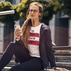 Our Strength is in our Unity Unisex Jersey Short Sleeve Tee