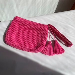 pink crochet clutch bag