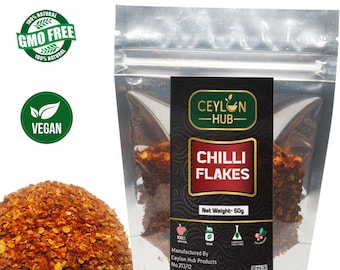 Biologische rode Ceylon-chilivlokken en -peul: Sri Lankaanse kruiden