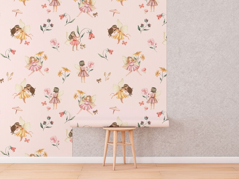 May include: Pink wallpaper with a repeating pattern of fairies, flowers, and butterflies. The wallpaper is rolled up on a wooden stool.