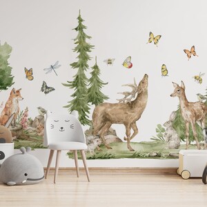 May include: A watercolor-style wall decal featuring a woodland scene with a deer, a fawn, a fox, a badger, butterflies, and dragonflies. The decal is perfect for a nursery or child's room.