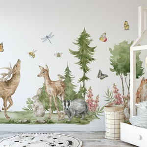 May include: A white wall with a woodland-themed mural featuring a deer, a fawn, a badger, a fox, butterflies, bees, and birds. The mural is surrounded by green trees and flowers.
