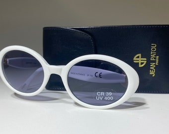 Vintage Jean Patou Sunglasses from 1990s, White oval shaped frame, cat eye, designer JP logo on side, dark tinted UV lens, name brand shades