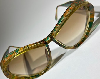 Vintage Christian Lacroix Sunglasses, red yellow green gold flower design frame, designer logo emblem on side, rare shades UV