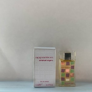 May include: A white box with the text "apparition emanuel ungaro" and a small bottle of perfume with a checkered pattern. The bottle is 5 ml or 0.17 fl oz.