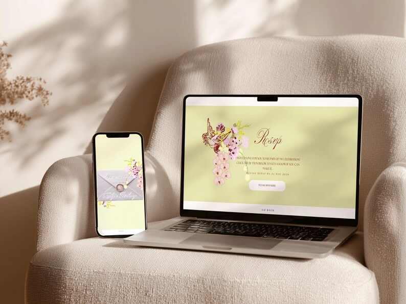 May include: A laptop and smartphone sit on a cream-colored armchair. The laptop displays a website with floral graphics and the word "Rosep." The smartphone shows a similar design. The scene is bathed in soft light, suggesting a focus on digital design or event planning.