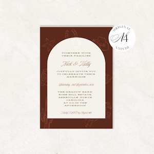 May include: A rectangular wedding invitation card with a dark brown background featuring line art of western icons like horseshoes, cowboy hats, and cacti. A central cream-colored arch contains text announcing the marriage of Nick and Kelly.