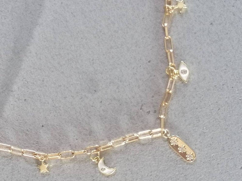 Wide chain links with eye charms moon and stars