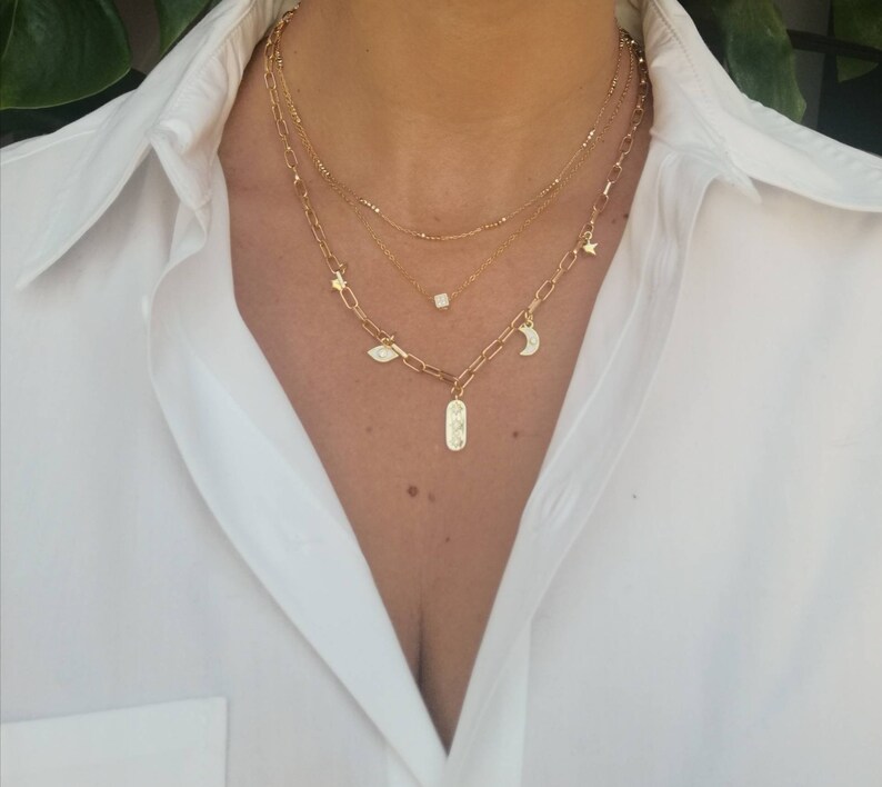 Wide chain links with eye charms moon and stars