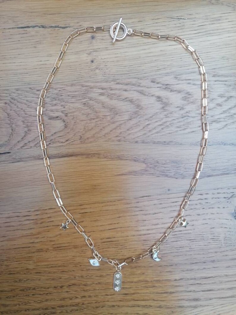 Wide chain links with eye charms moon and stars