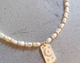 Freshwater pearl necklace and moon and star medal