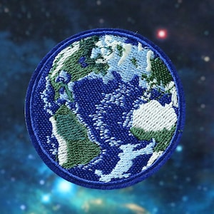 May include: Embroidered blue, green, and white patch of the Earth against a dark blue starry background.