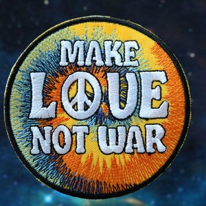 May include: A round, yellow and blue embroidered patch with the text "Make Love Not War" and a peace sign.