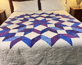 Edredón tamaño king con diseño de rueda de carpintero en tonos azules y morados