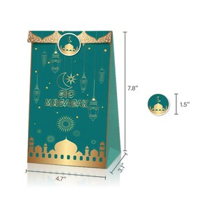 May include: Green and gold gift bag with a mosque and lanterns design. The bag is 7.8 inches tall, 4.7 inches wide, and 3.1 inches deep. The text "Eid Mubarak" is printed on the bag.