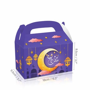 May include: Purple favor box with a crescent moon and stars design. The box has a handle and says "Eid" on the front. The box measures 9.5 inches by 9.5 inches by 6.3 inches.