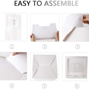 May include: A six-step assembly guide for a white cardboard box with a clear window. The box has a letter "B" printed on the window. The steps are numbered 1 through 6.