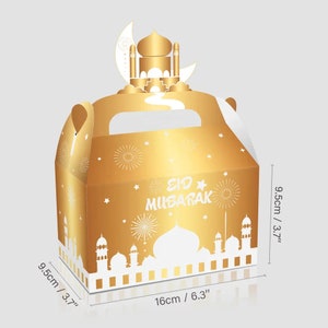 May include: Gold gift box with a handle, featuring a white silhouette of a mosque and the text "Eid Mubarak". The box measures 9.5 inches by 9.5 inches by 6.3 inches.