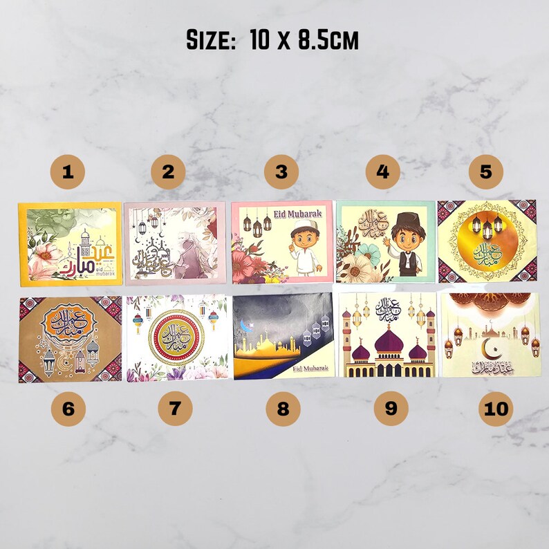 May include: Ten different designs of Eid Mubarak greeting cards, each featuring a different illustration. The cards are 10 x 8.5 cm in size.