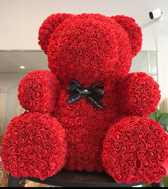 giant teddy bear with roses