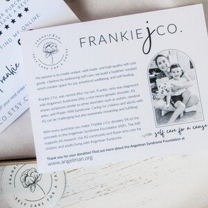 May include: White cards with the Frankie J Co. logo and text. One card has a photo of a woman and child. The text includes "self care for a cause" and information about the Angelman Syndrome Foundation.