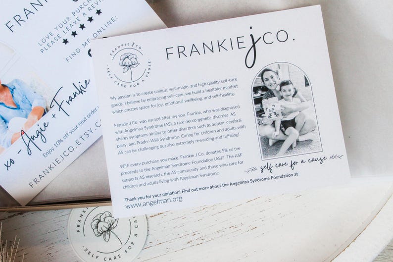 May include: White cards with the Frankie J Co. logo and text. One card has a photo of a woman and child. The text includes "self care for a cause" and information about the Angelman Syndrome Foundation.