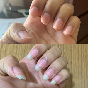 May include: A split image shows a hand with short, unpainted nails above a hand with long, French-manicured nails. The nails are a natural pink with white tips, showcasing a before-and-after comparison of nail care.
