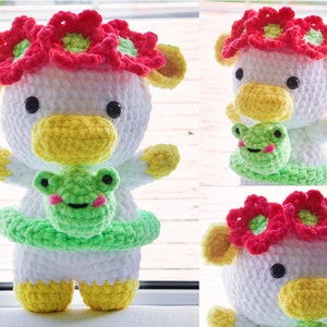 May include: White crocheted stuffed animal with a yellow beak and red flower crown. The animal is holding a green crocheted frog.