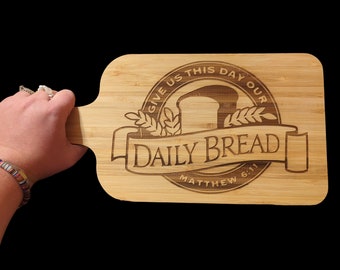 Give us this day bamboo cutting board