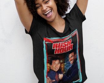 May include: Black V-neck t-shirt with a graphic of Jackie Chan and Chris Tucker from the movie "Rush Hour".